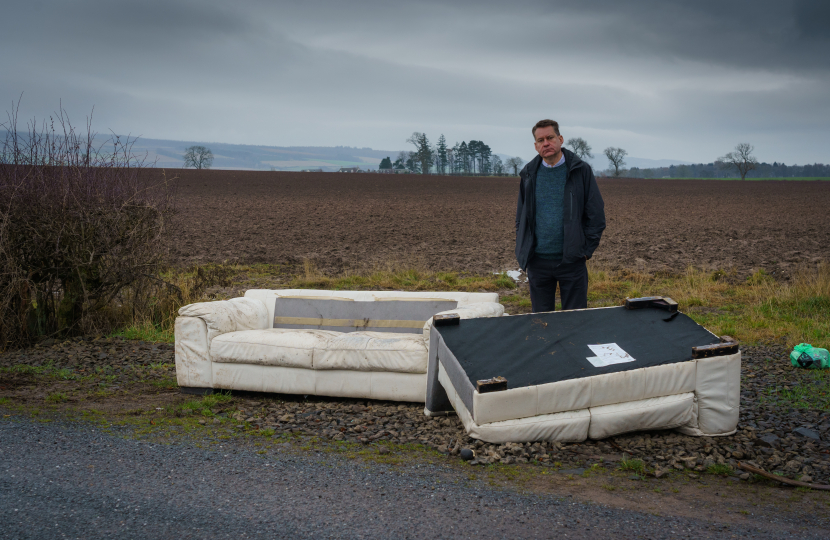 Murdo beside some fly-tipping