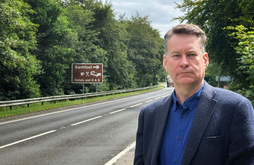 Murdo Fraser MSP beside the A9 Perth to Inverness road