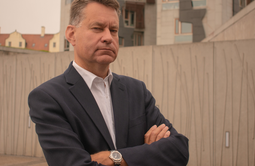 Murdo pictured beside the Scottish Parliament