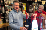 Murdo pictured pouring a pint at the Airlie Street Bar in Alyth