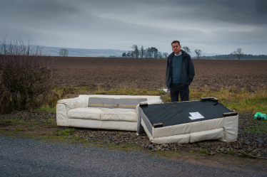 Murdo beside some fly-tipping