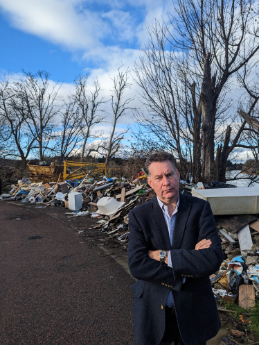 Murdo beside the fly-tipping near the River Tay in Perth