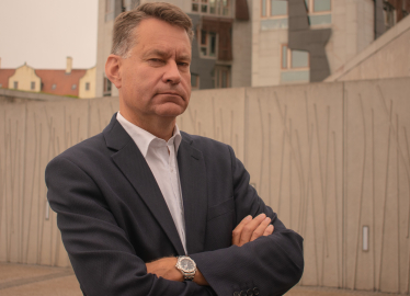 Murdo pictured beside the Scottish Parliament